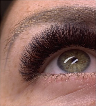 Close-up of full, dark volume lash extensions
